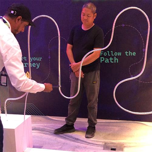 Giant Buzz Wire rental in Dubai with custom branding and wire shape for corporate events, brand activations, and carnival games in the UAE